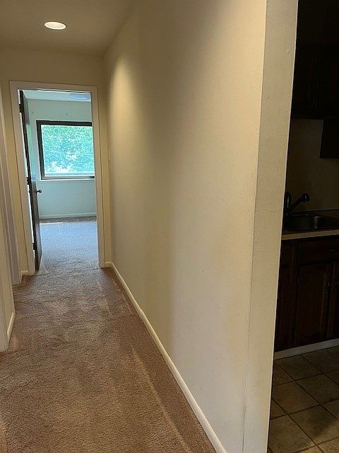 Hallway from living room to bedrooms and laundry