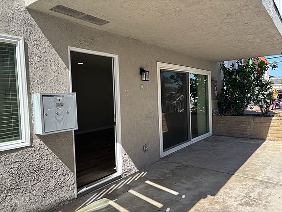 Entry door and sliding glass door to patio access