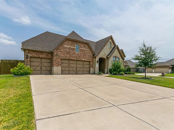 Extra wide driveway and 3 car garage