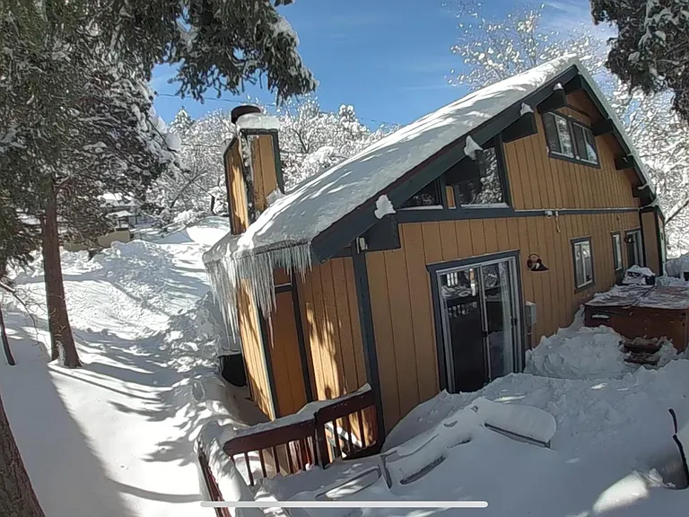 picture on the back of house from when it was snowing in January 0f 2024