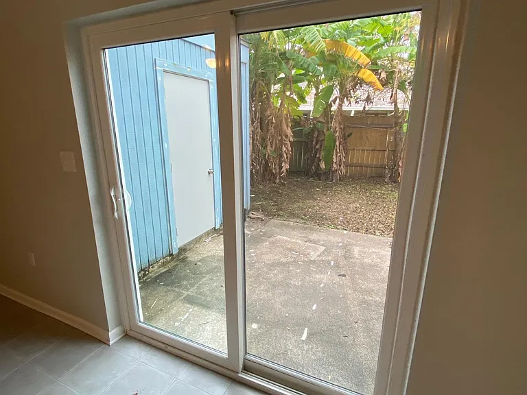 slider door with view of backyard