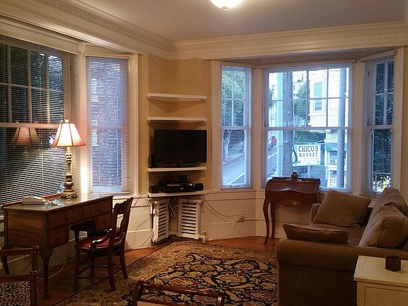 Living room with bay windows.