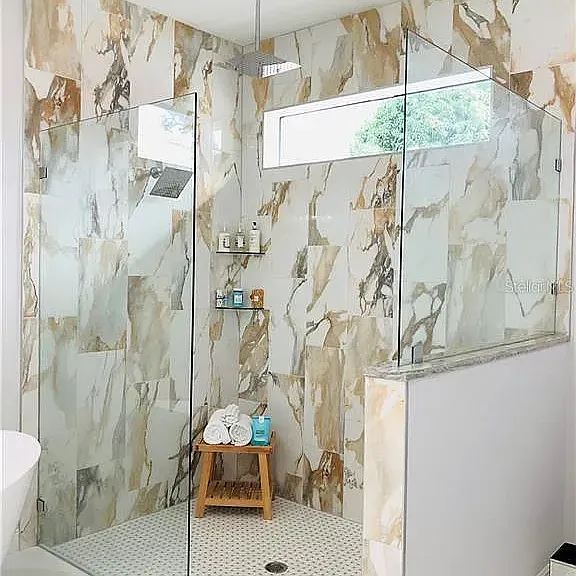 Spacious Walk-In Shower with Designer Tile