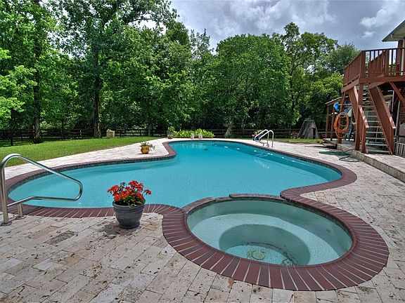 Another view of the beautiful, large, in ground pool, with built-in, jetted spa.