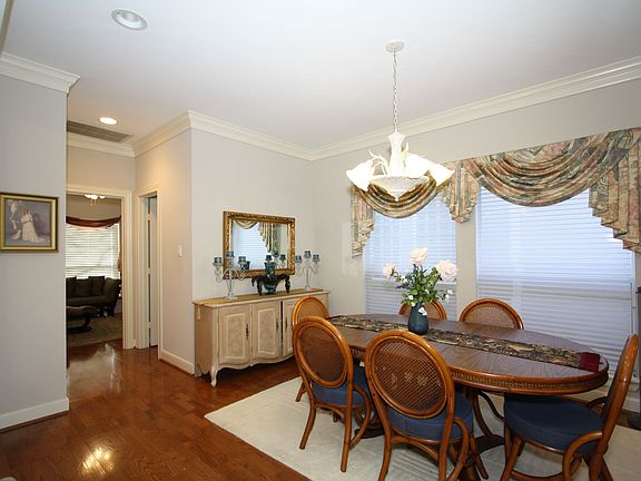 Formal dining area also features wood floors.