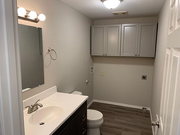 Downstairs half bath/utility room.