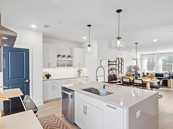 Kitchen with spacious center island and pendant lighting