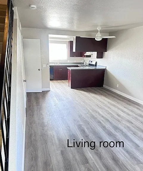 "Bright living space with modern flooring."