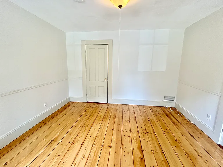 Living room with wood floors redone