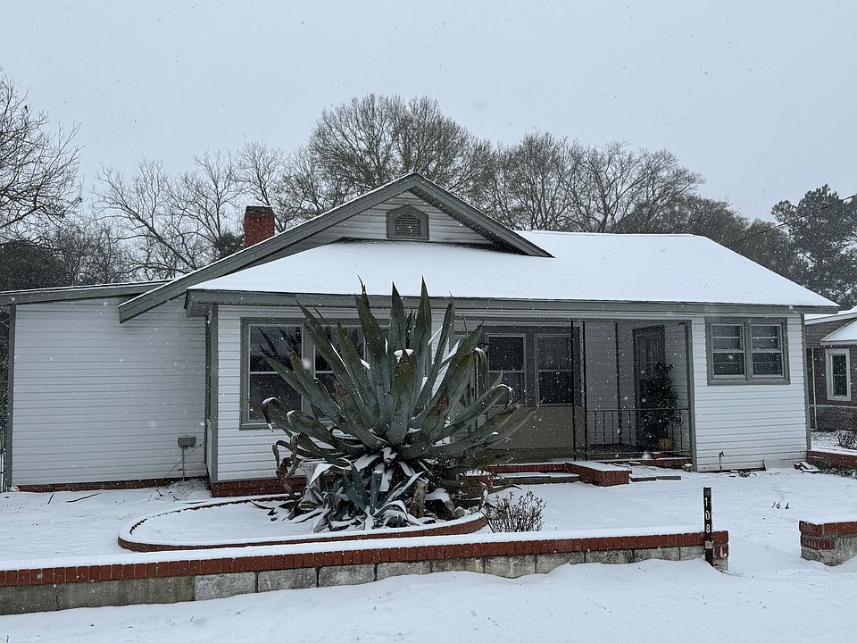 Nice landscaped yard. Sun porch on front perfect for growing flowers year round