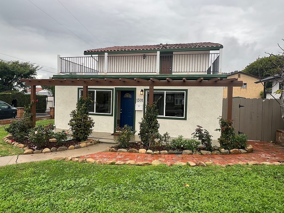 Front entrance and gate to back yard
