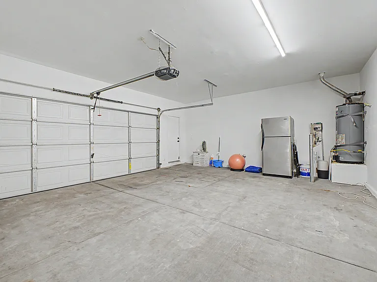 2 1/2 large sized garage with Tesla charger and garage fridge