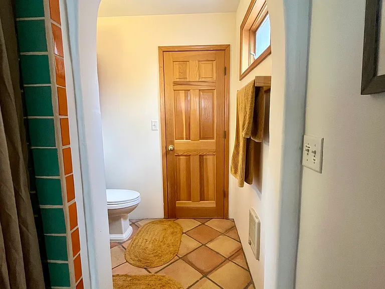 Casita/mother-in-law quarters bathroom with sink, toilet, and shower.
