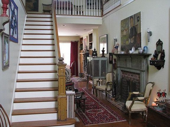 Grand foyer with firepl