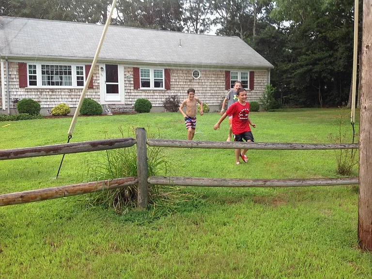 Kids at play in the sprinkler!