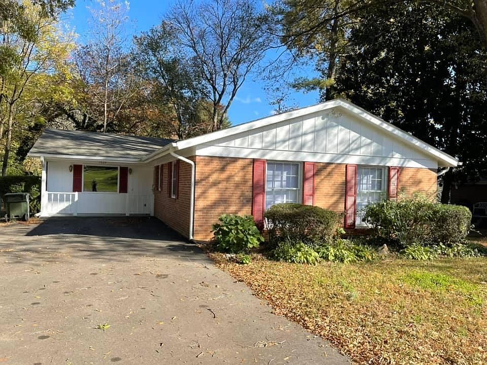 Front view with large off street parking and covered front entrance