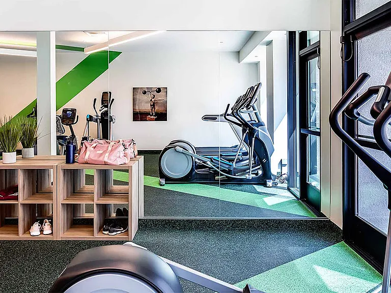 Apartment community 24-hour fitness center with Fitness on Demand at Griffis Pine Avenue in Long Beach, California.