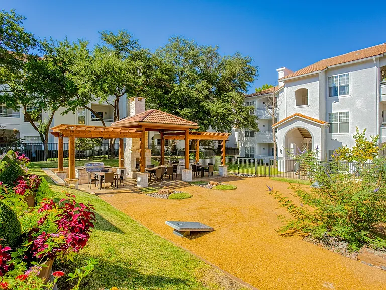 Outdoor courtyard complete with games, seating, and grilling areas. Perfect for entertaining guests!
