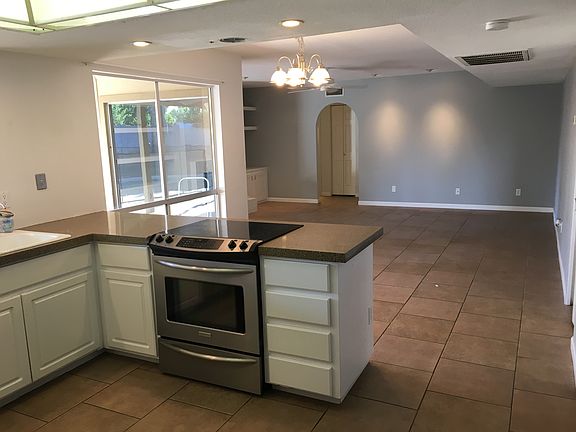 View from kitchen, through breakfast nook into family room