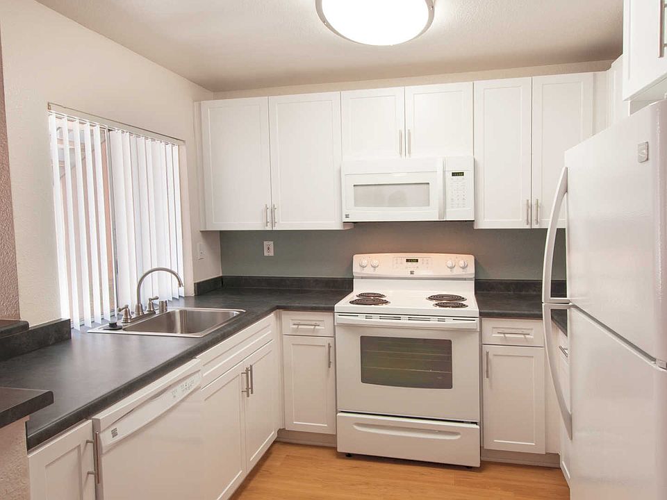 Kitchen with Upgraded Counters and White Cabinetry