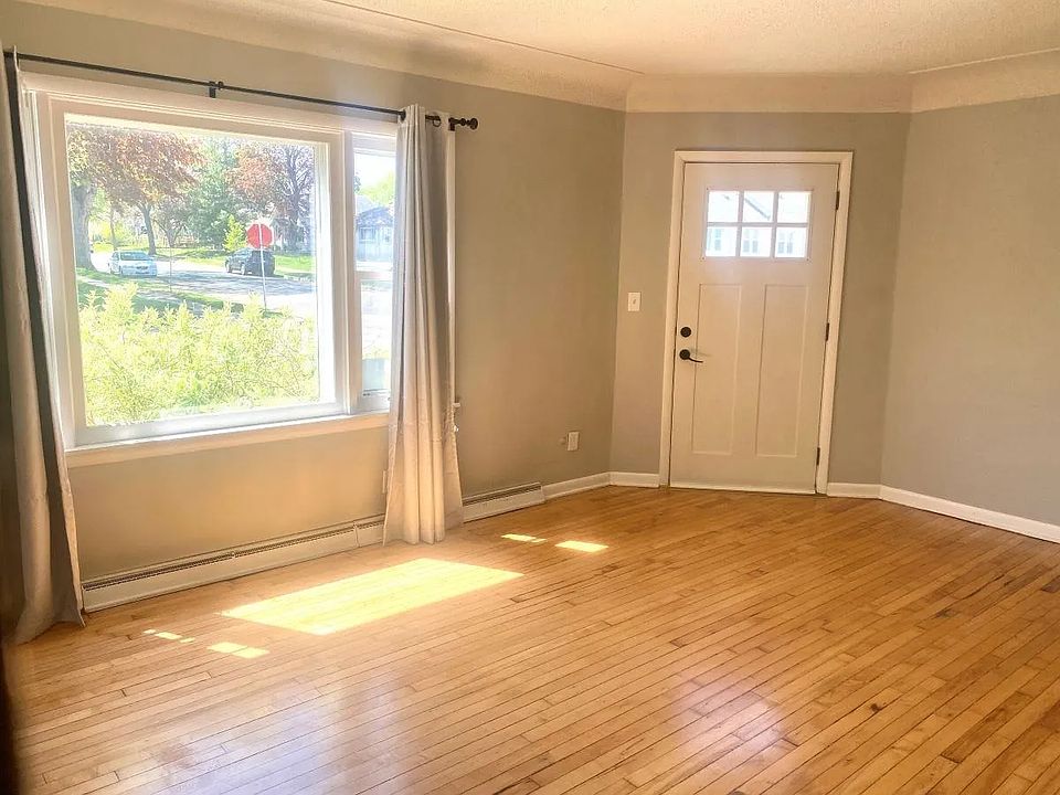 Walk into a warm, sun-filled living room with beautiful hardwood floors and plenty of natural light. A space that instantly feels like home _ perfect for relaxing, hosting, or enjoying your day-to-day life.
