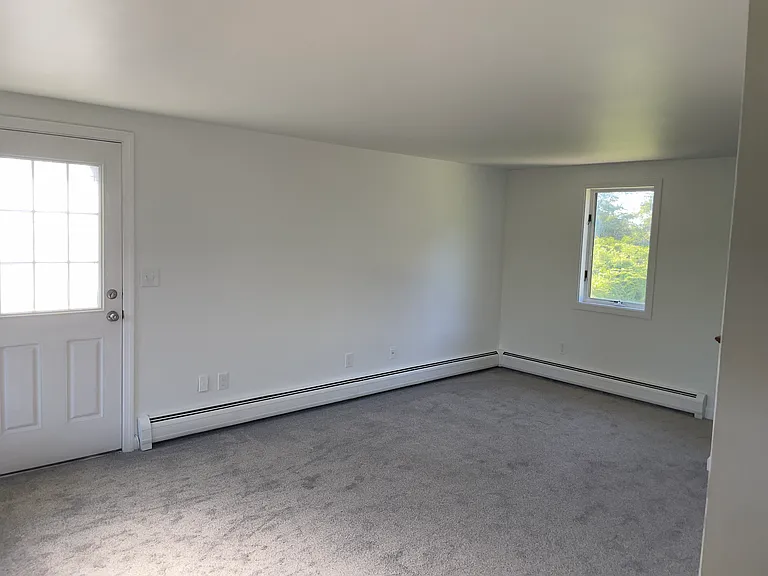 New carpet, electrical and woodwork in living room.