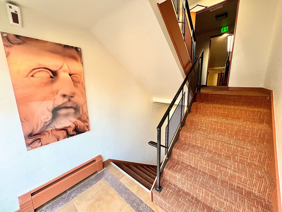 Step into style with this beautifully crafted stairwell featuring captivating artwork.