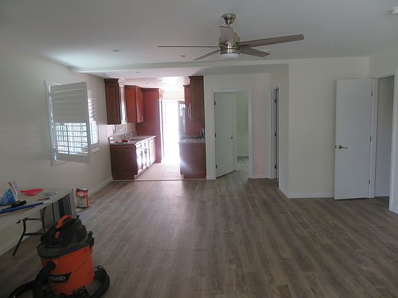 Living room with recessed lighting and fan as is everyroom throughout.