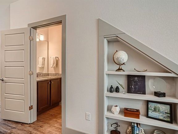 Built in shelves & additional storage under stairs