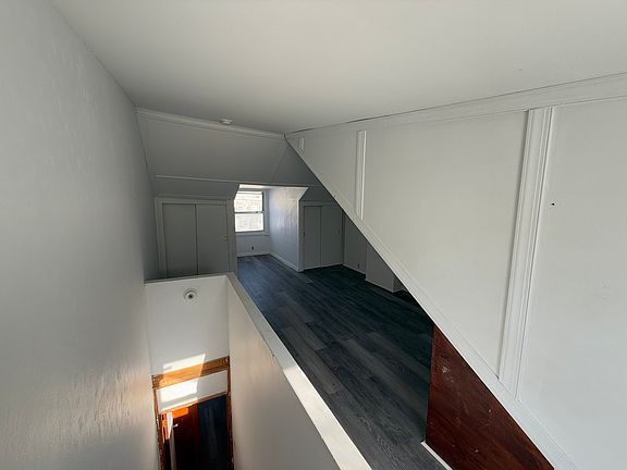 Attic bedroom with an abundance of storage space.