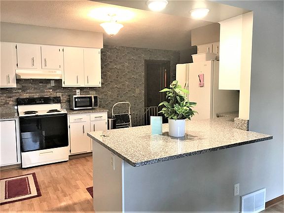 Newly updated kitchen with granite countertops.