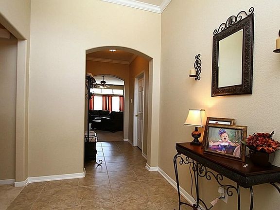 High Ceilings, Neutral Paint + Tile Floors in Entry & Hallway
