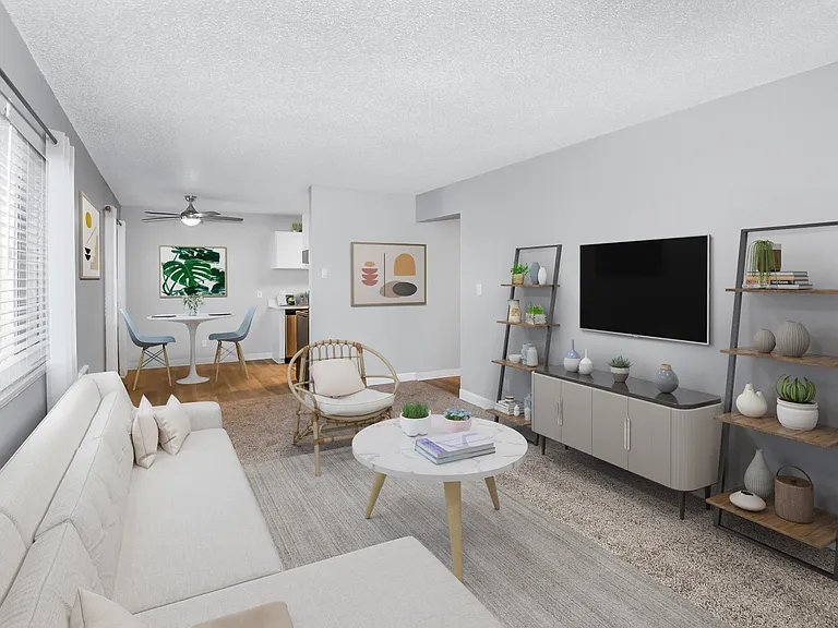 Cozy living room with carpet and dining nook
