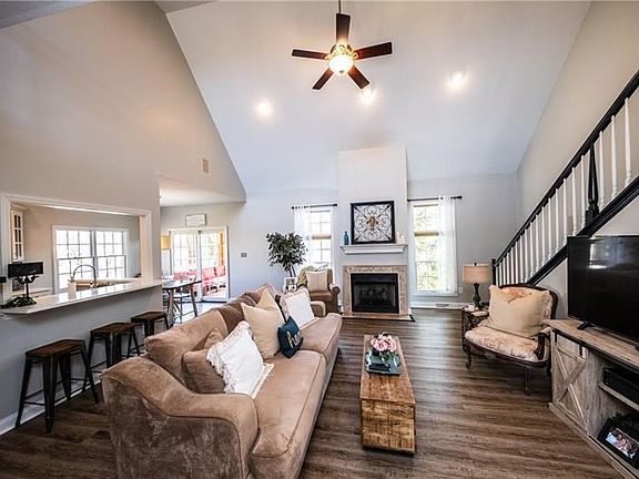 Open floor plan in living room, and eat in kitchen with a newly added quartz extended counter top to add bar stools for extra se