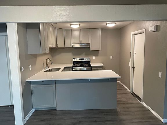 bar seating area with storage cabinet underneath