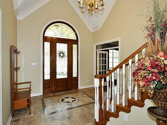 Beautiful front door and tile entry