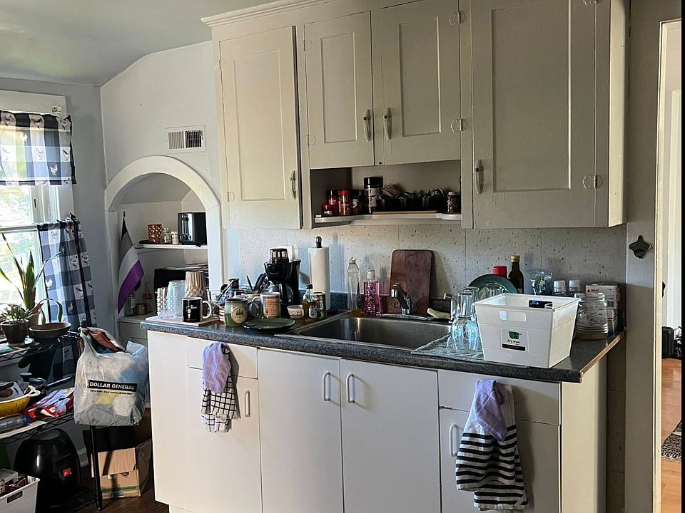 Large kitchen with built in for microwave. No disposal.