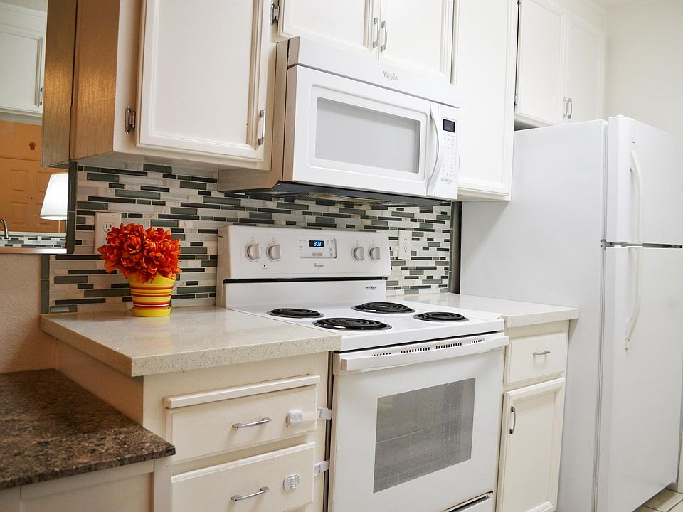 Kitchen - Updated quartz countertop, tile backsplash, painted cabinets