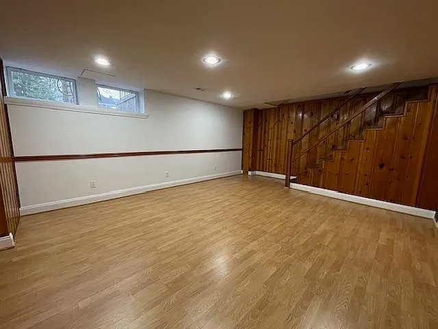 Basement view of windows and stairs.