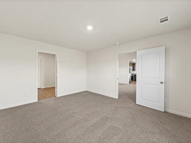 The master suite of the Sabine has a large bedroom, en-suite bathroom and a spacious walk-in closet.