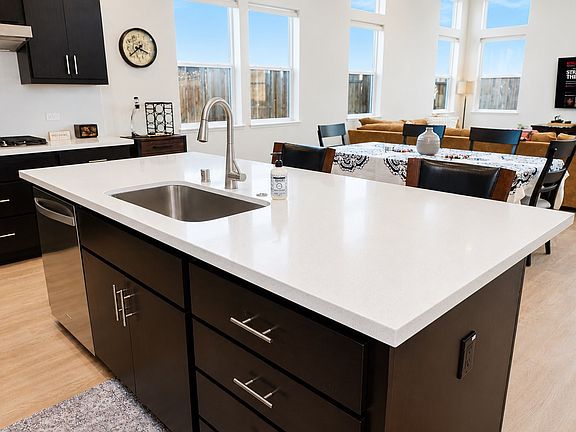 Large Windows Allowing the Full Natural Light to Light Up the Kitchen, Dining Room , and Living Room