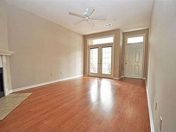 Living room front entrance with french doors leading to patio