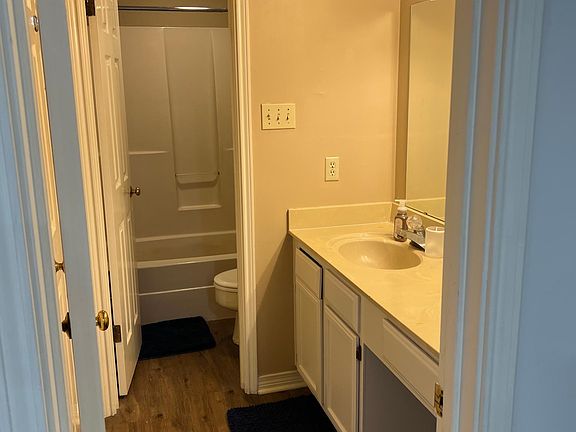 Bathroom off downstairs bedroom; accessible through the room as well as the hall of the main entrance.