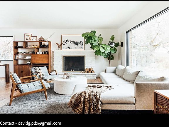 Living Room looking East. Large living room window provides lots of natural light. The house has all new, energy efficient, double pane windows and doors.