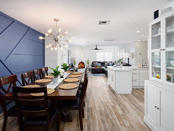 Dining area opens to Kitchen and 2 Family Rooms