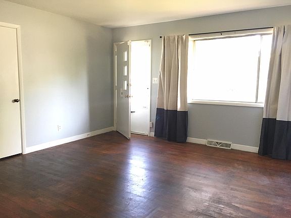 Large living room with lots of natural light.