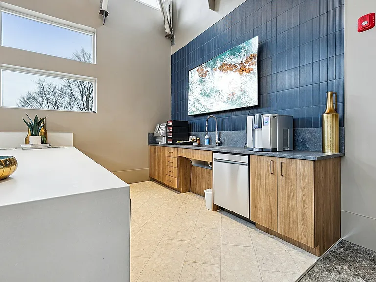 Experience the elegance of this contemporary kitchenette, perfect for modern living.