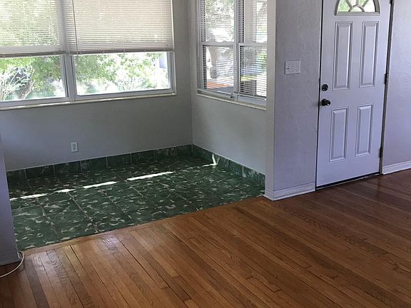 living room to open 4 season porch and front door