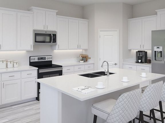 This contemporary kitchen was designed for the way busy families live today, boasting a large center