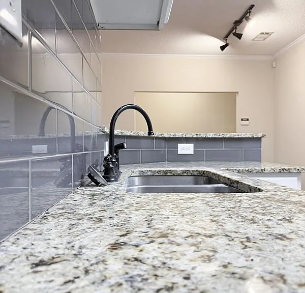 Real granite tops with tile backsplash.